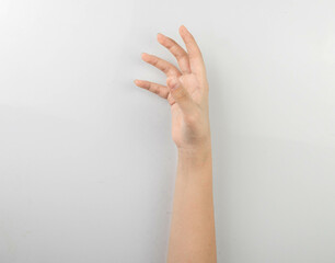 little girl hand something empty back side.
Hand isolated on white background.