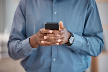 Cellphone, hands and closeup of businessman typing a message on the internet or mobile app. Technology, networking and African male person scroll on social media or website with phone in the office.