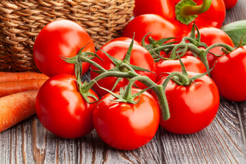 tomato branch on wood background