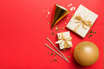 Holiday background with colorful balloon, gift and confetti. Flat lay style. Birthday or party...