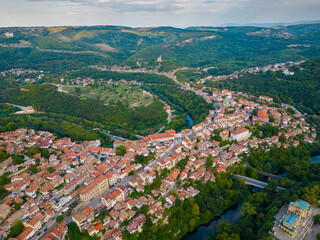 An aerial view of Veliko Tarnovo reveals a Bulgarian city rich in history and culture, with its beautiful buildings, streets, and picturesque hills.