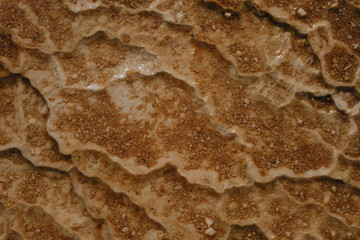 Georgia, Kazbegi region. Truso Valley, Caucasus. Mineral springs flow directly from the mountains and form white crystals containing iron. An amazing and beautiful place. Close view.