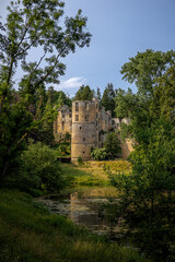 The medieval dilapidated ruin with the name 'chateau Beaufort' in the town of Beaufort, a castle that attracts many tourists, Luxembourg - obrazy, fototapety, plakaty