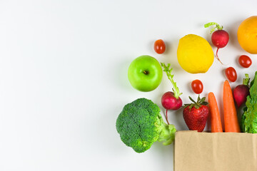 Healthy food background, healthy vegetarian food in paper bags, fruits and vegetables, banner copy...