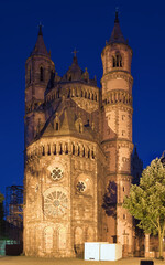 West facade of Worms Cathedral in dusk, Germany. The cathedral was built from about 1130 to 1181. This is one of the three Rhenish imperial cathedrals besides the Mainz Cathedral and Speyer Cathedral.