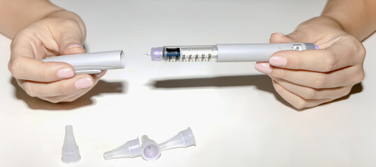 Female hands holding an insulin pen. Ozempic Insulin injection pen.