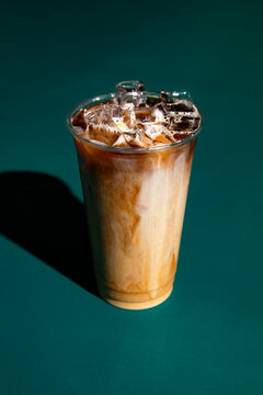 Iced Latte on Green Surface 