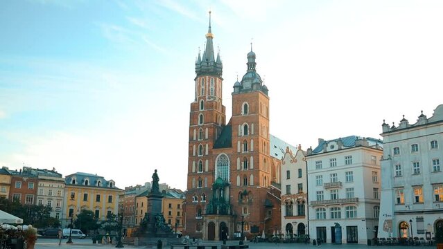St. Mary's Basilica on the Krakow Main Square (Rynek Glowny) during the sunrise, Poland. High quality FullHD footage
