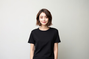 Obraz premium Mock Up Beautiful Woman In Black Tshirt And Jeans On White Background
