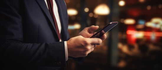 Account manager using a contemporary smartphone with a blurred background
