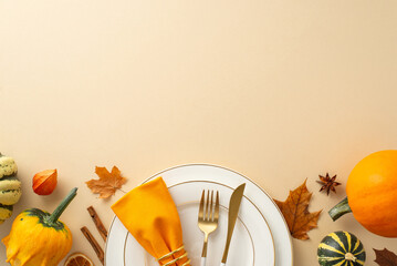 Above view captures essence of family Thanksgiving dinner with gilded tableware, classic cutlery,...