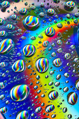 Silvery swirling water drops in cosmic rainbow Saturn ring in psychedelic background asset