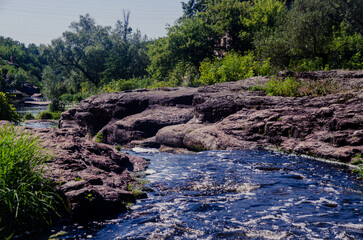 a river in the middle of a beautiful canyon