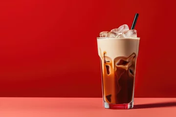 Zelfklevend Fotobehang Iced Holiday Peppermint Cold Brew with Milk on a Red Background with Space for Copy © JJAVA