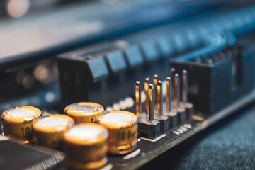 Socket pins and resistors on motherboard close-up of a desktop PC. Computer hardware chipset...