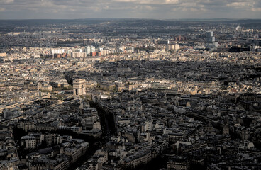 Paris, France - April 3 2019: The arc de triomphe from the eiffel tower over the streets of Paris on a clear day