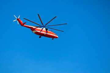 Moscow, Russia - August 04, 2023: big red helicopter against the blue sky