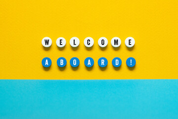 Welcome aboard - word concept on building blocks, text