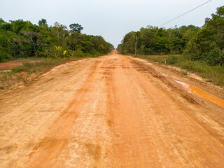 Traveling on the famous BR-319 in dry season, a dirt road through the Amazon rainforest between...