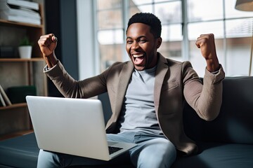 African american black man celebrating something laptop, winning a bet, earning money online