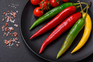 Hot chili peppers of three different colors red, green and yellow