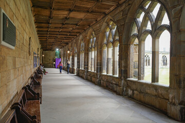 Durham, UK - 12 July, 2023: Cloisters and interior lawn of Durham Cathdral, England