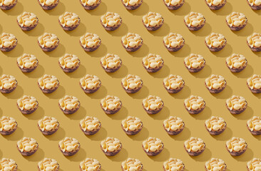 Pattern of pasta conchigliei noodle in wooden bowl on brown pastel background
