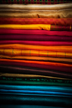 stack of colorful silk fabrics