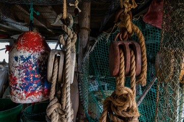 Fishing ropes are tied and various objects are hanging from the ceiling