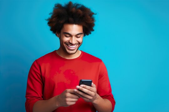 Happy Young Man Typing on Smartphone, Shopping Online, and Using Trendy Apps, Blue Background, Typing Message