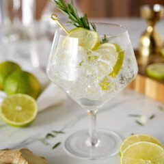 Close up of glass with lemon alcohol drink on the table