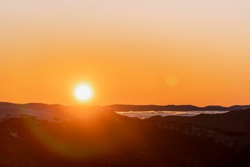 Aerial view of a mountain range at sunset