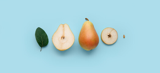 Ripe pears on light blue background, top view