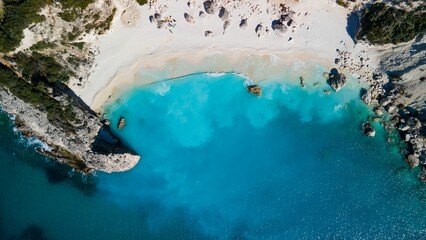 Aerial view of Agiofili Beach and crystal clear blue water from the ocean on the Greek island