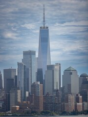 Manhattan Cityscape surrounded by a river in the daylight in New York City