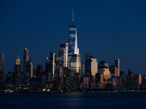 Manhattan Cityscape surrounded by a river in the evening in New York City