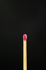 Match sticks in the dark background.