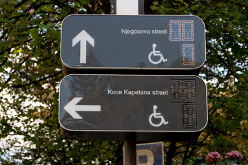 Parking for drivers. Free parking for the disabled; marked with road markings and a notice sign. Adapted spaces for people with disabilities. Inclusion.