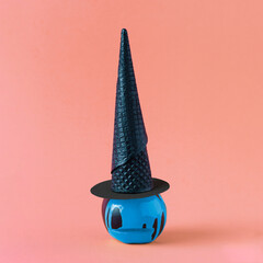 witch’s hat on blue leaking color apple head