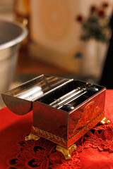 Church paraphernalia for the baptism of a child on the table in the temple