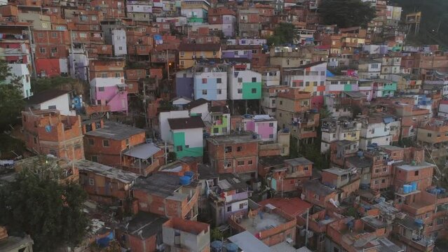 Close-up aerial rising past colourful favela houses in Rio de Janeiro, Brazil
