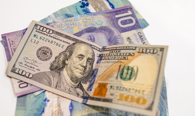 Canadian dollars vs. US dollars, which are important for board trading between these neighboring countries.