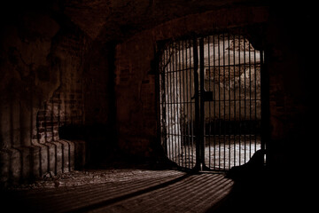 Light glowing from Iron grate in old cellar