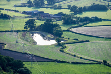 Power lines running overhad,across rural countryside of Herefordshire,England,United Kingdom.