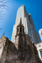 Fototapeta premium presbyterian church. gothic architecture of church with skyscraper on background. architectural design of the city. church and skyscraper