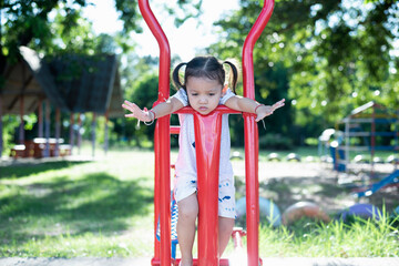Children playing on a summer day Playground in the park Children's entertainment and recreation.
