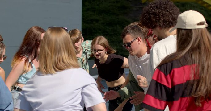 Young adults rhythmic synchronous movements. Group somatic therapy or bodywork. People play games. Therapeutic approaches that focus on the body to promote physical and emotional well-being. Lifestyle