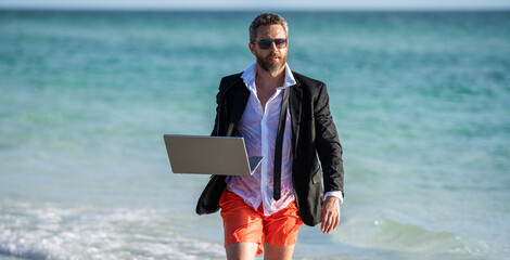 businessman relax at beach. businessman in suit with laptop in summer. Businessman dreams on summer...