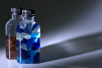 Plastic bottle containers coloured glass stones