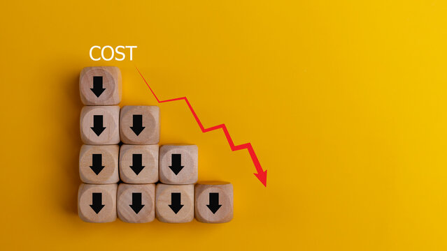 Lean or Cost reduction concept. Optimize manufacturing management. Decreasing company expenses to maximize profits. wooden cube with the words cost and red down arrows. Business improvement.